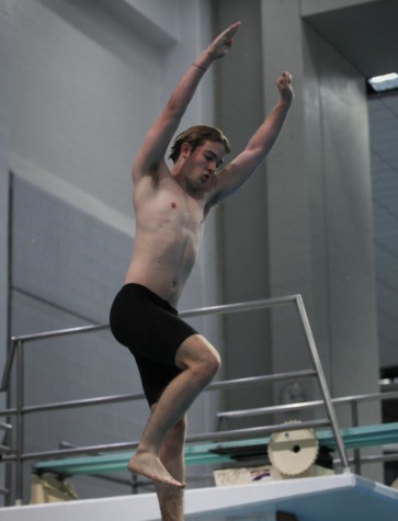 Senior Tucker Lawson jumps off the diving board for the 1 meter diving tournament.