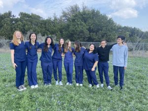 LINED UP: The senior students in the Health Science Practicum class pose for a photo in their blue scrubs to commemorate their achievements. These students will graduate high school with a Certified Medical Assistant (CMA) license.