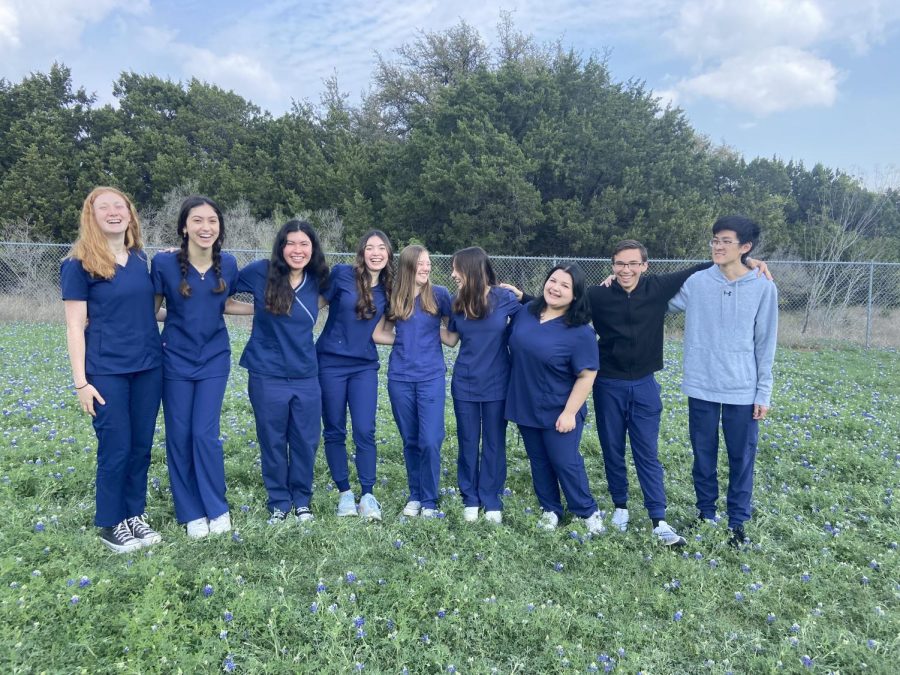 LINED+UP%3A+The+senior+students+in+the+Health+Science+Practicum+class+pose+for+a+photo+in+their+blue+scrubs+to+commemorate+their+achievements.+These+students+will+graduate+high+school+with+a+Certified+Medical+Assistant+%28CMA%29+license.