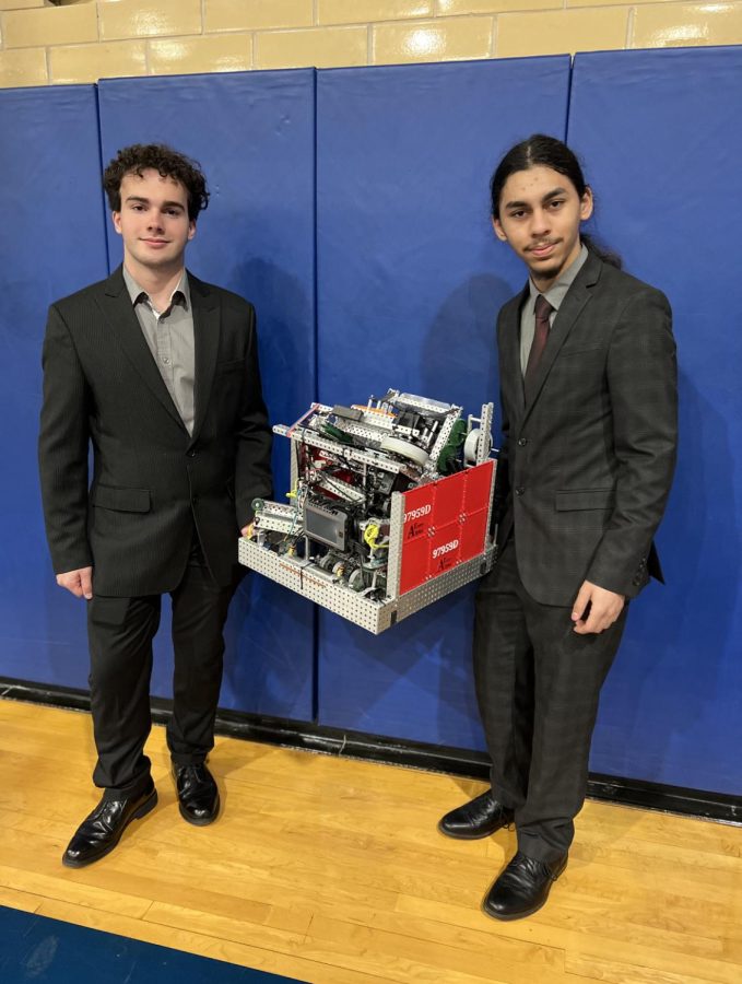 BOBOT THE ROBOT: Junior Carson Roman (left), and Senior Joseph Weis (right) will compete at Dallas for the VEX World Championship. Their team, Alpha Entity, has refined their robot over the past couple of months to prepare for each round and section they will be competing in.