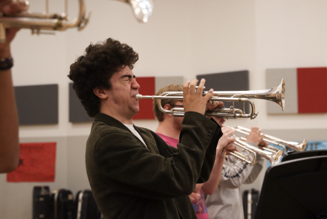 PLAYING A TUNE: Junior Christopher Meeks practices a song with the Bowie band, as a member of the trumpet section. Meeks has been interested in music since he was a little kid, but began this instrument in sixth grade when he joined his middle school band.