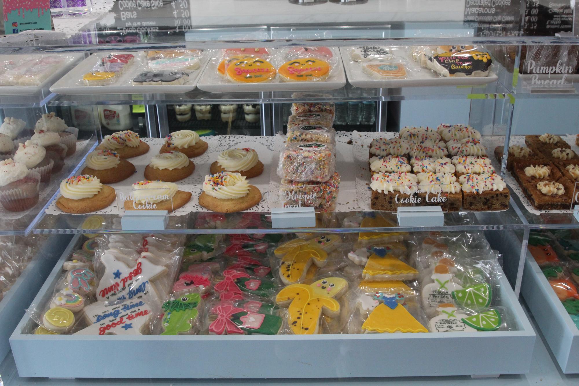 Tasty treats lined up in the case ready to be bought and eaten.