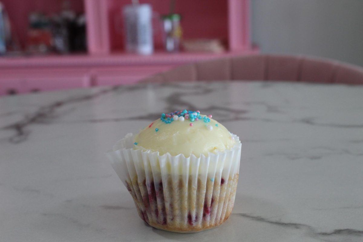 Cupcake flavored razzle dazzle filled with berries and a smooth layer of frosting on top. 