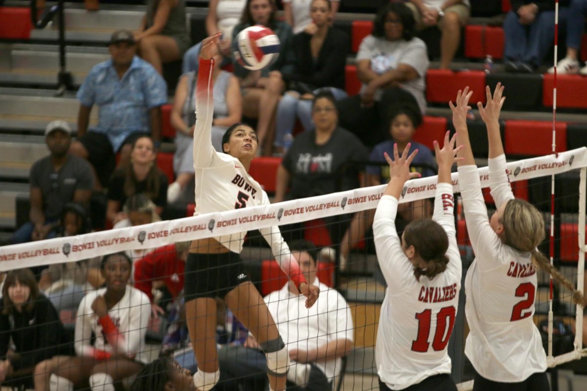 ATTACK AND KILL: Freshman Jazzlyn Hepburn goes up for the kill against the Lake Travis Cavaliers. The Lady ‘Dawgs ended up losing to the Cavaliers in three straight sets, 3-0. 