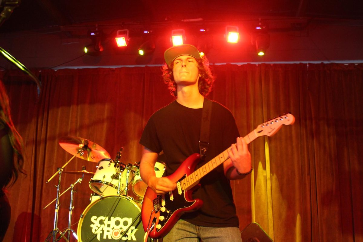 ROCK & ROLL: Shredding the cords, sophomore Gavin Carney is playing for school of Rock. Carney is practicing for his upcoming ACL performance, Carney plays multiple instruments and switches between the, for each show.