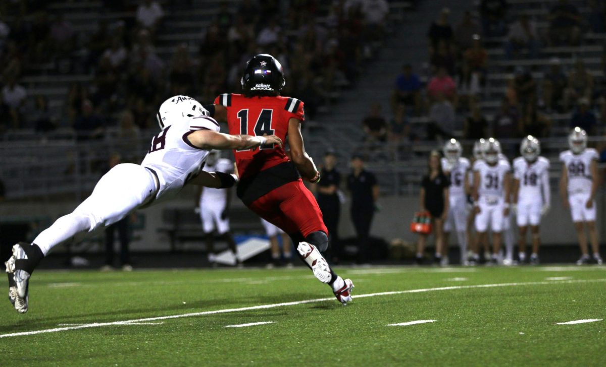 WR Carmine Elisarrarazz (Senior) dodges a tackle after a punt return. The dawgs had a total of 194 passing yards and 119 rushing yards this game.
