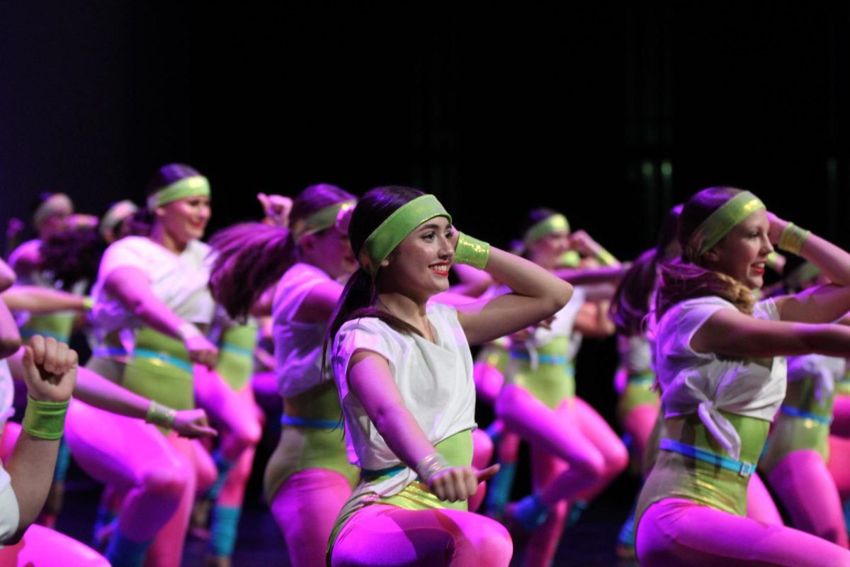 TAKING THE STAGE: Sophomore Gabby del Nido dances in a bright number. “The Showcase helped me bond with my friends and my teammates and was a great experience” del Nido said