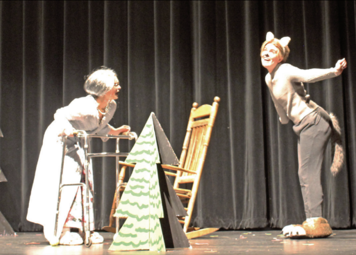 BIG BAD WOLF: Junior Milo McKinney scares fellow actor sophomore Charlotte Schwarte, who plays grandma in their show, Totally Red.