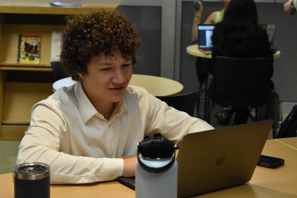 Sophomore Reed Watts prepares his arguments for his debate tournament at Westlake High School. High school students from all over AISD gather at Westlake to compete in the tournaments.