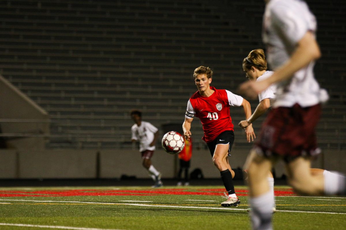 UP THE FIELD: Senior attacking midfielder Jake Cicarello, runs to the ball up the field.  Cicarello secured his second hat trick of the season this game