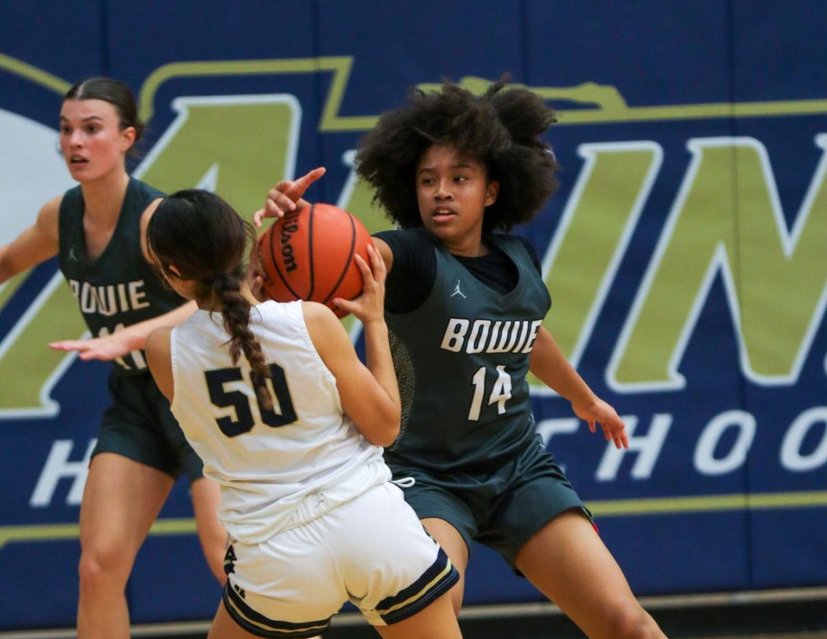 GETTING+A+STEAL%3A+Freshman+Daniella+Williams+attempts+to+steal+the+ball+from+the+opposing+guard.+Daniella+is+one+of+two+freshman+on+varsity.+