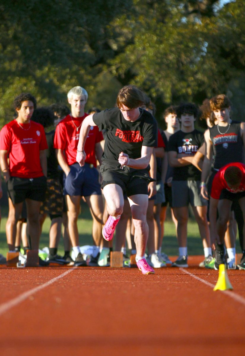 OFF THE BLOCKS: Junior sprinter Owen Langdon bursts out of the blocks during practice. Langdon focuses on a strong launch to give him a good start in his races.