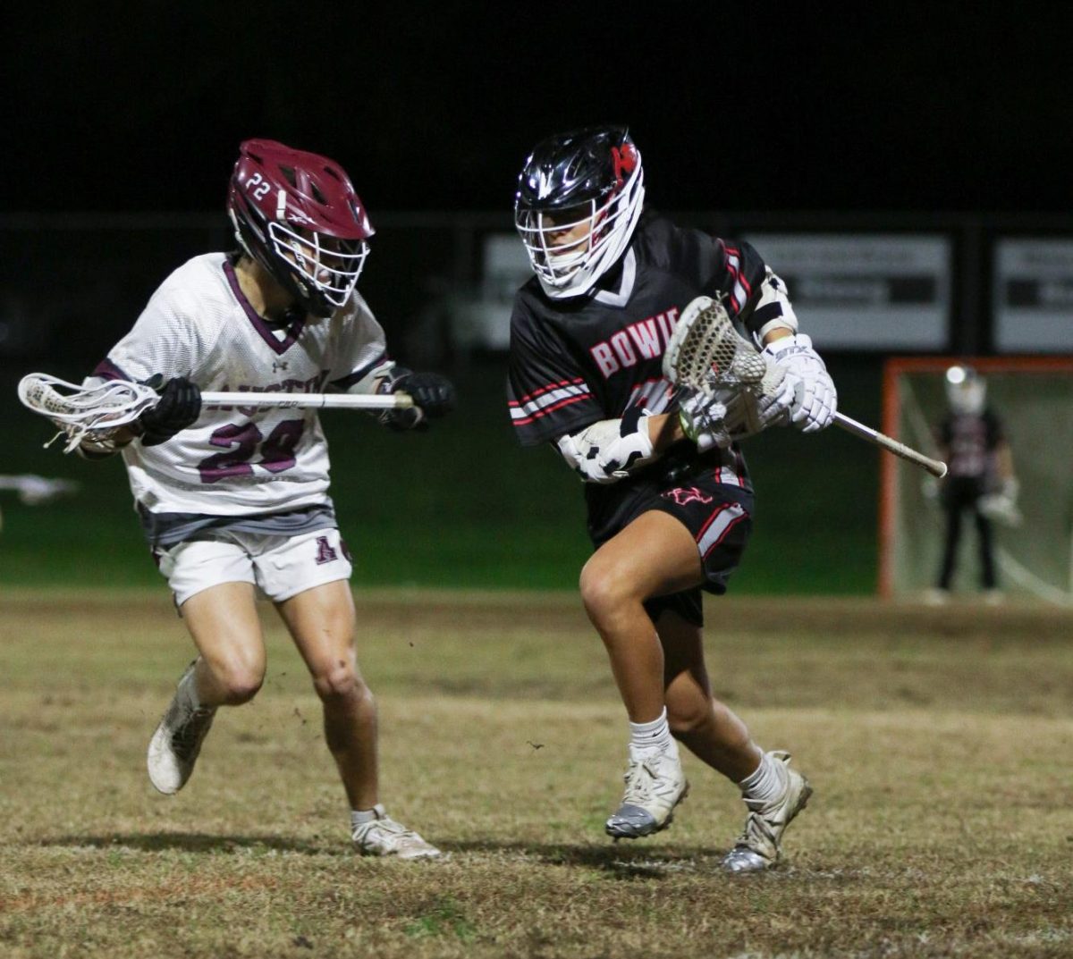 FACE-TO-FACE: Sophomore Cole Wong runs toe-to-toe with an Austin High defender. Bowie struggled offensively and end up losing 21-2 to the Maroons “They are a very experienced and physical team, and we have a lot to work on,” midfielder Wong said. “My game knowledge and field vision is better this year and I hope that I can utilize those skills to score more goals and help my teammates.”