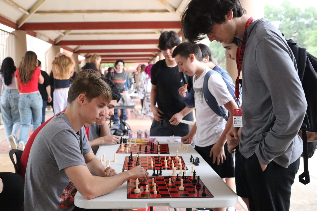 COMPETITION+CLASHES+ON+CHESS+BOARD%3A+Senior+Issac+Hoke+concentrates+on+his+chess+game+against+sophomore+Nathan+Musat.+No+Place+For+Hate+hosted+a+community+fair+for+clubs+to+encourage+inclusion+and+acceptance+at+Bowie.