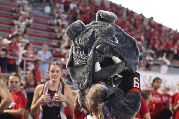 HIGH SPIRITS: Along with the cheer team, the bulldog mascot kept energy high throughout the whole game.  “We have trust in our team, our family, and on the field,” said sophomore receiver Evan Dranguet when asked about how we kept energy throughout a rough 1st half, “we just remember all the work we put in on holidays and weekends and how we know we can trust everybody on this field.”
