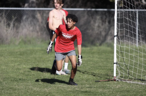 KEEP YOUR GUARD: Sophomore Carter Jones defends his goal during soccer practice. Soccer students have practice every day after school. 