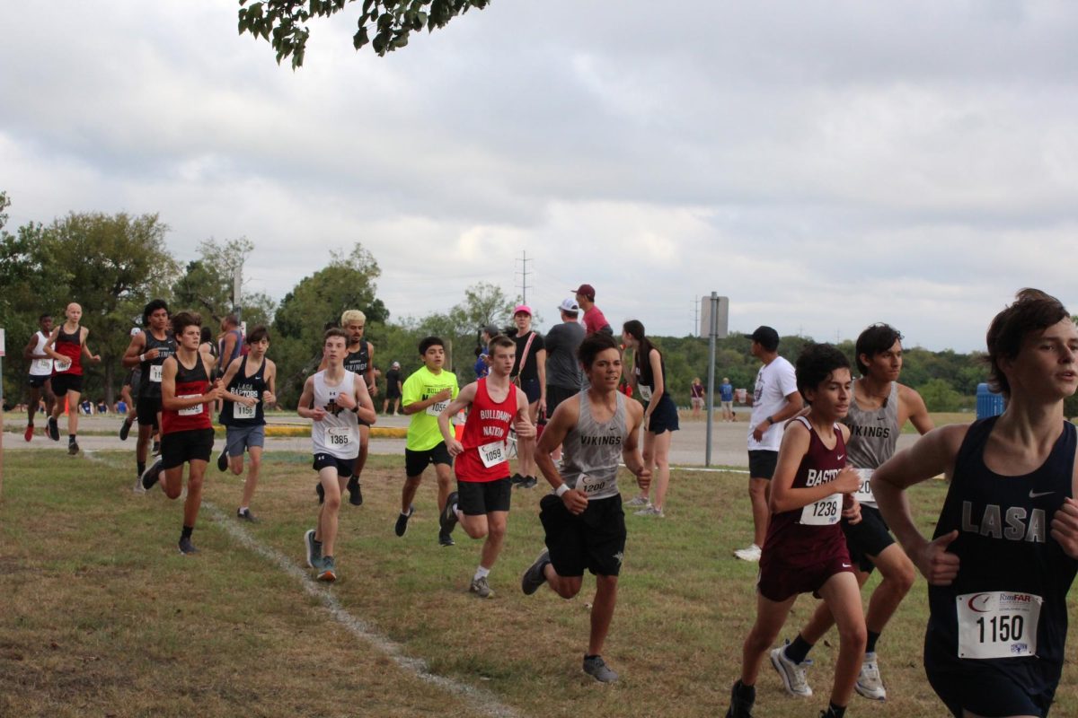 RUNNING HOME: Working hard, sophomore Owen Witherspoon pushes himself to the end of the race. The Bowie Bulldogs finished first at the Austin ISD invitational. 