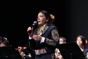 Junior Analicia Rodriguez sings to the crowd. This is Rodriguez's first year on mariachi. She joined in hopes of feeling more connected to her Mexican culture. 