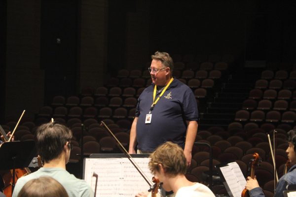 New Orchestra Director, David Jarrot, leads students in rehearsal for an upcoming concert. 