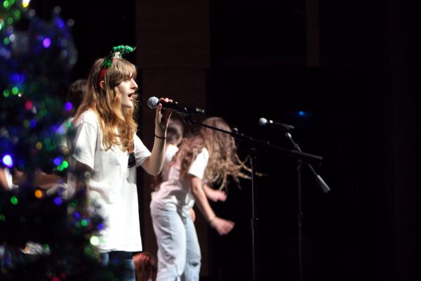 Ending off "Last Christmas" with a powerful solo, a senior member belts a tune alongside Bowie Choir. 