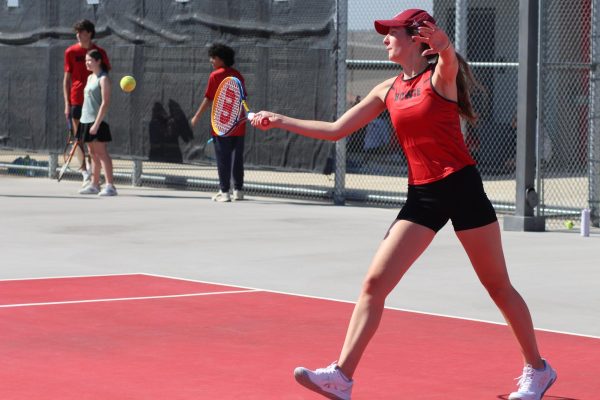 Strongly swinging student Jil Schwe leans in for a powerful hit hoping to score points for her team. 