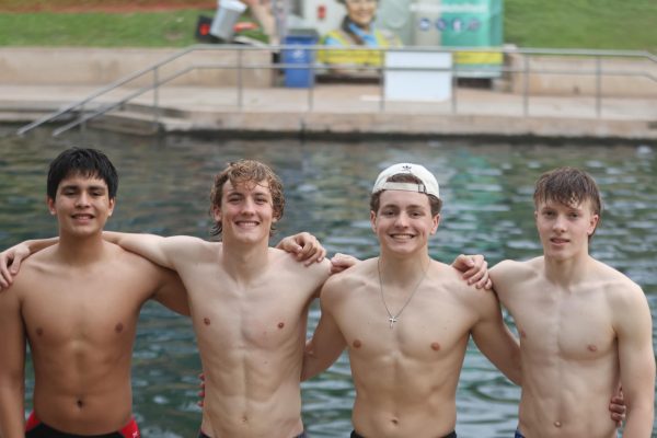 SWIM SUPERSTARS: Juniors Javier Gutierrez-Jaimes and Rowan Cox, sophomore Walker Aitchison, and freshman Alex Eland pose proudly after advancing to state. The relay team broke a school record with a time of 1.34.87 seconds. 