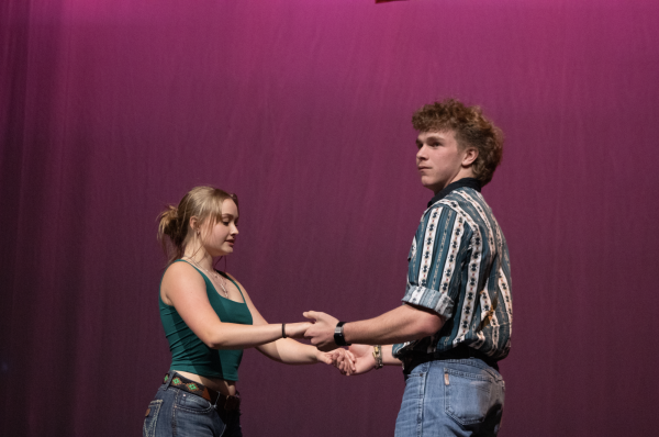 ONE TWO STEP: Senior Manning Adkins and junior Weston Strange hold hands as they prepare to start their country dance. Both Adkins and Strange are a part of Bowie’s Country Kickers club where they are taught new country dances. “Every Wednesday we have a country kickers club meeting,” Adkins said. “Most Saturdays we go to a dance hall called Wild West where we mainly just dance and try out new tricks we learned during our weekly meetings.” 