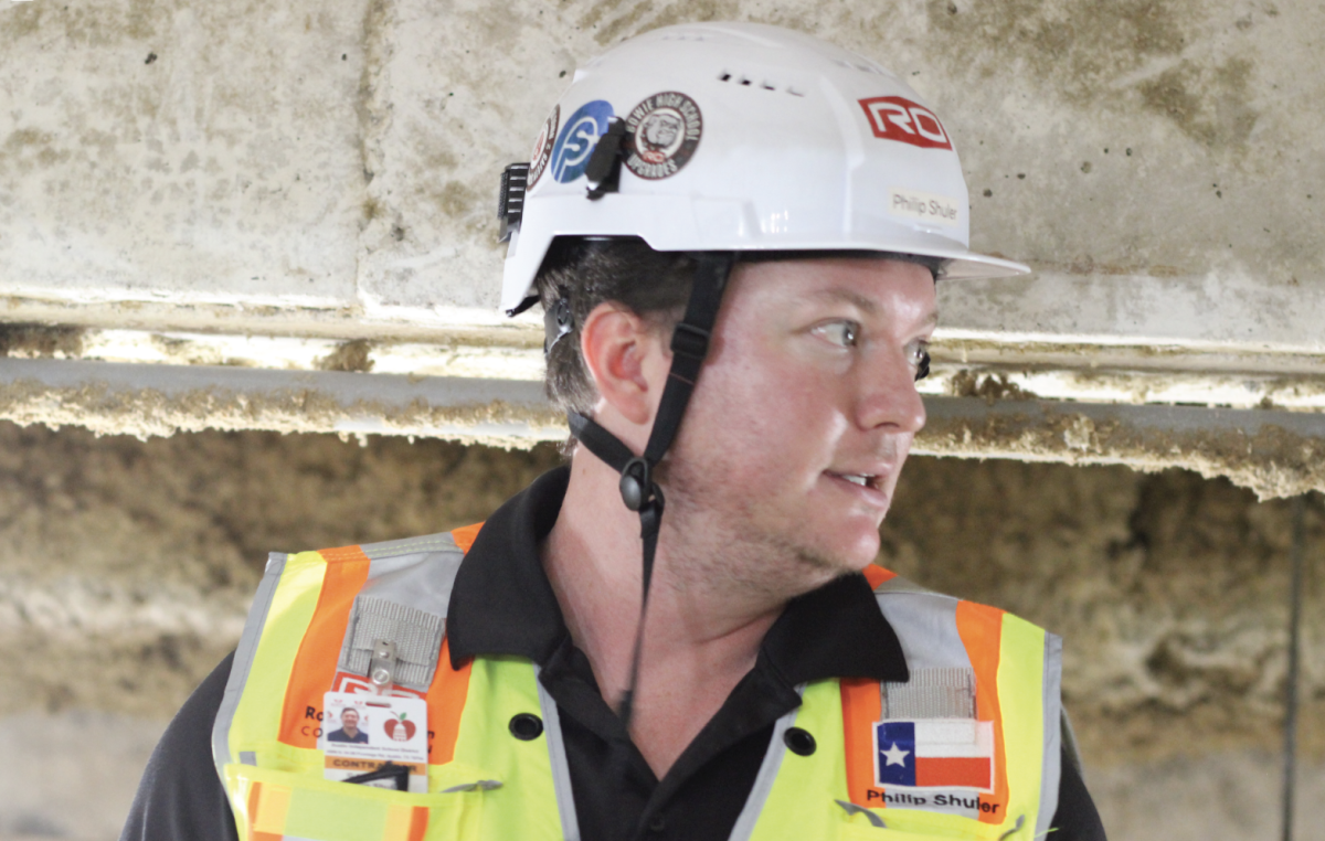 UNDER THE SURFACE: Contractor Philip Shuler sheds light on the new cold water pipes being installed underneath F and E Halls of the Academic Building. This will allow for more enhanced cooling of the building's classrooms.