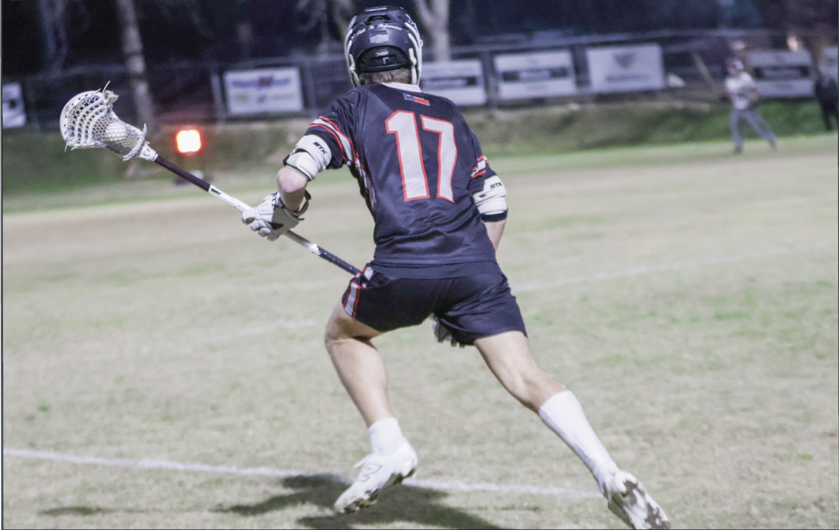 GOAL ATTACK: Junior attacker Brody Marquart runs toward goal ready to shoot and score for the Bowie boys lacrosse team. The lacrosse team had a good playoff run that ended in the second round.