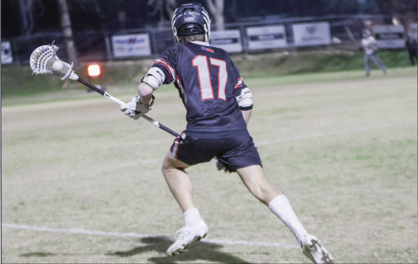 GOAL ATTACK: Junior attacker Brody Marquart runs toward goal ready to shoot and score for the Bowie boys lacrosse team. The lacrosse team had a good playoff run that ended in the second round.