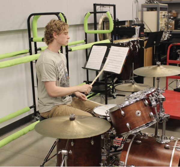 UNSTOPPABLE ENERGY: Frost loses himself in the rhythm, his focus intense as he drums with passion. Each strike is a reflection of the hard work and dedication to his music career.