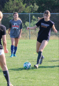ADVANCING THE FIELD: Her feet racing, Ava Grosso remains concentrated on the ball as she dribbles throughout the field. Commanding each contact with purpose, she creates with the ultimate goal of pushing the ball forward.
