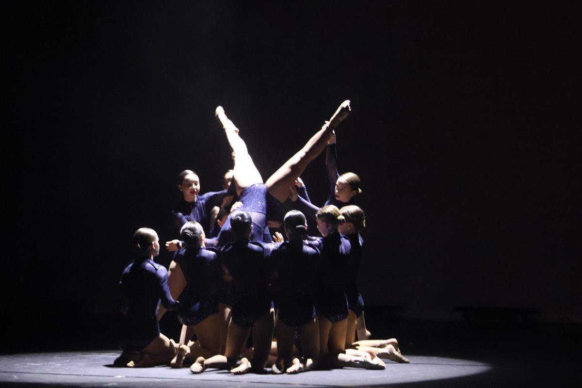 THE PYRAMID: In an elegant pyramid, the Silver Stars team sets up for the climax of the performance. The audience was shocked by their skills. “The show was phenomenal,” sophomore Tatum Mast said. “I was amazed with the Stars ability to move with strength, and the pyramid was very impressive.”