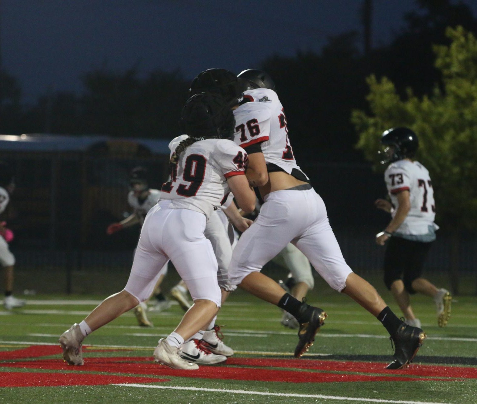 STANDING STRONG: Maddie Kerrigan (#49) goes all in, meeting her opponent in a head to head tackle. Determined she continues pushing with purpose, the ultimate goal being to knock the opposing player over.