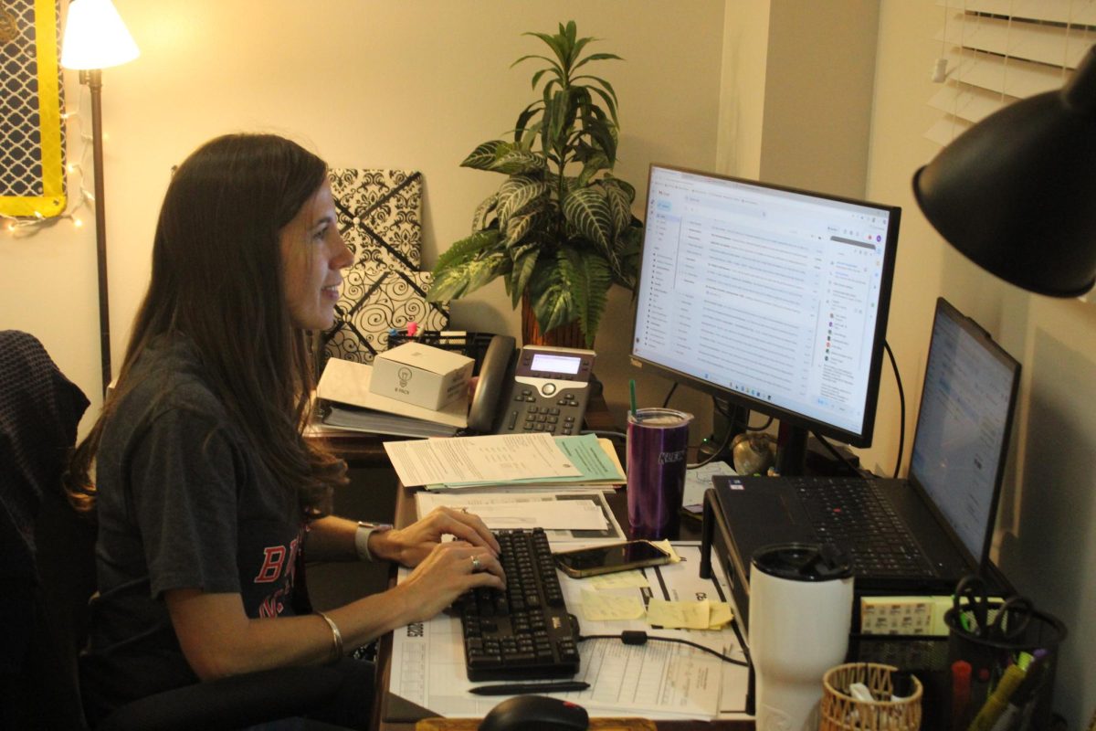 HARD AT WORK: New Assistant Principal, Ms. Loeb sits in her office, sending emails across
the district. Helping students across the school with whatever they may need in this vast
academic world.