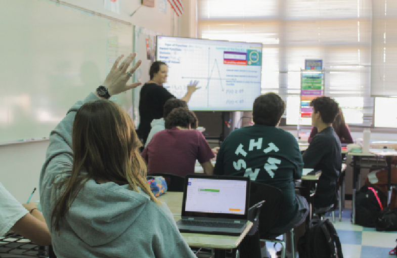 QUESTION TIME:  Math teacher Natasha Weissmiller is seen teaching, while being interrupted by a student who needs to use the bathroom during her lesson. She now has to go approve the request from her computer, using the software Enriching Students.