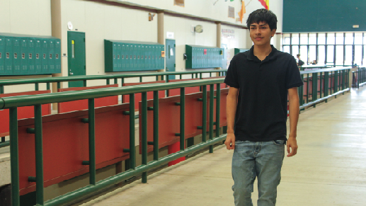 HALLWAY HAZARDS: A student seen walking through the halls without his ID. Having an ID through the halls is replacing the previous bathroom passes that were provided  to each teacher.