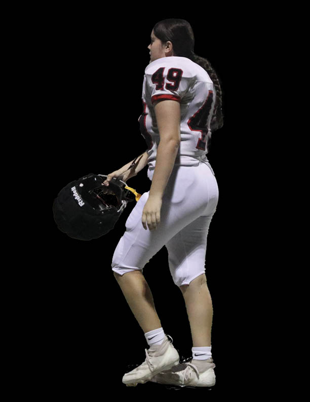 WALKING WITH PURPOSE: Maddie Kerrigan steps off the field after a hard fought game. The Bowie Bulldogs came out victorious.