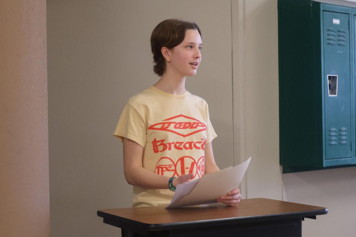 SHARPENING IDEAS: Sophomore Holly Herman stands at her lectern. The debate class helps students learn how to organize and promote their argument.