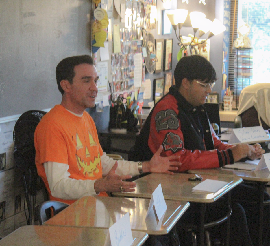 TAKING THE LEAD: Student Council advisor Alejandro Garcia speaks with various club leaders. This took place during the first Bowie U.N. meeting, featuring leaders from several clubs to discuss the plans for the organization.