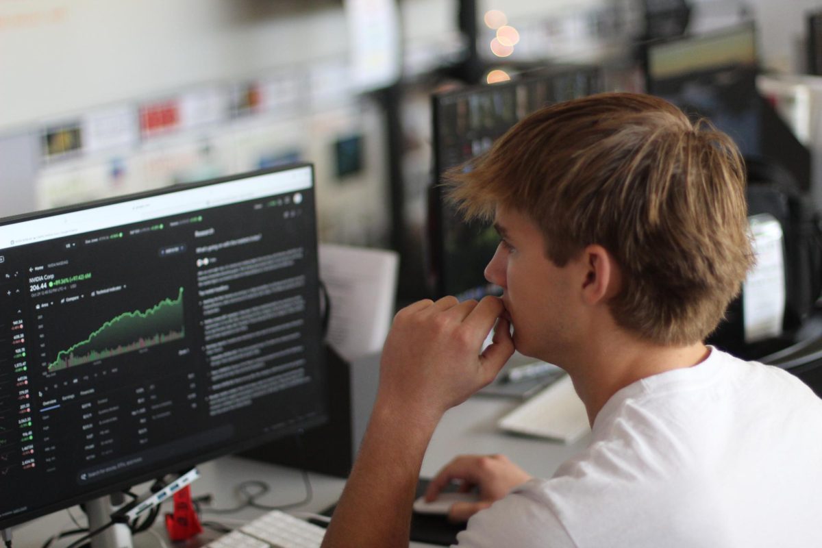 STUDYING UP: Senior Brendan Binford spends his time learning about and investing in stocks. Through this process, he sparked   a passion for teaching others about investing. Thus, Young Investors Society was started, a club at Bowie dedicated to doing so.