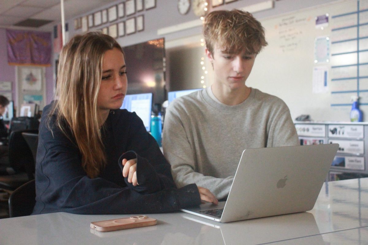 FUNDRAISING FRENZY: Maddie and Charlie Debelak shown working on the Eliphino Website. Eliphino uses their website and social media platforms as their main form of running their first fundraising campaign lasting from Nov. 15 to Dec. 15.