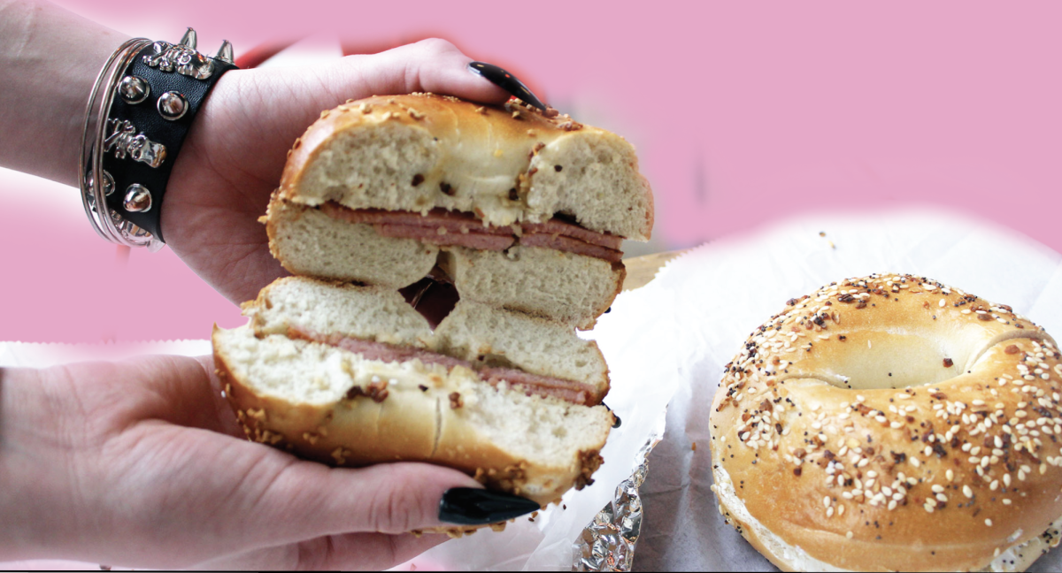 BAGEL SANDWICH: The inside of one of Wholy Bagels bagel sandwich with ham and American cheese, as well as a classic everything bagel with cream cheese. The two items together run about $15.