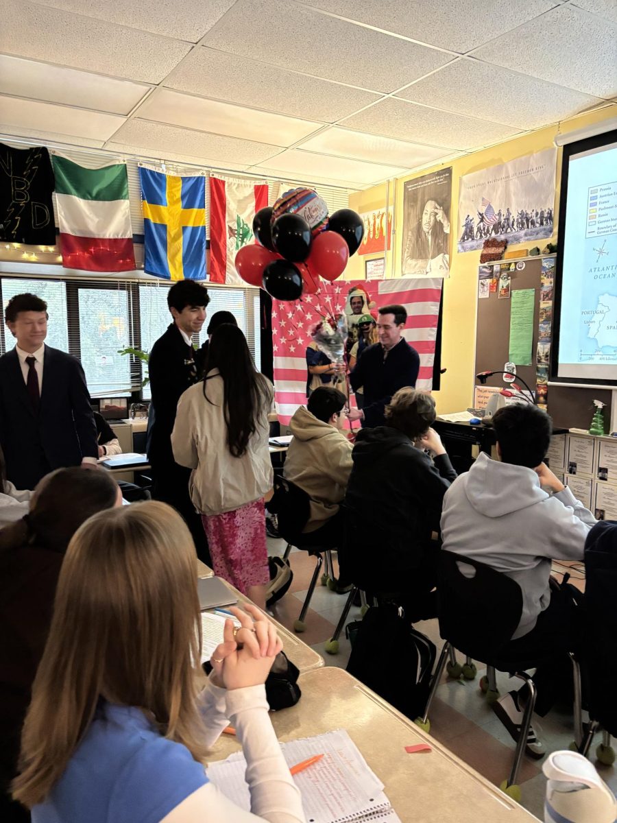 WINNER, WINNER: Alejandro Garcia is announced as the 2025-2026 teacher of the year. During his first period various student council presidents as well as staff greeted Garcia with gifts to celebrate his contributions to Bowie.