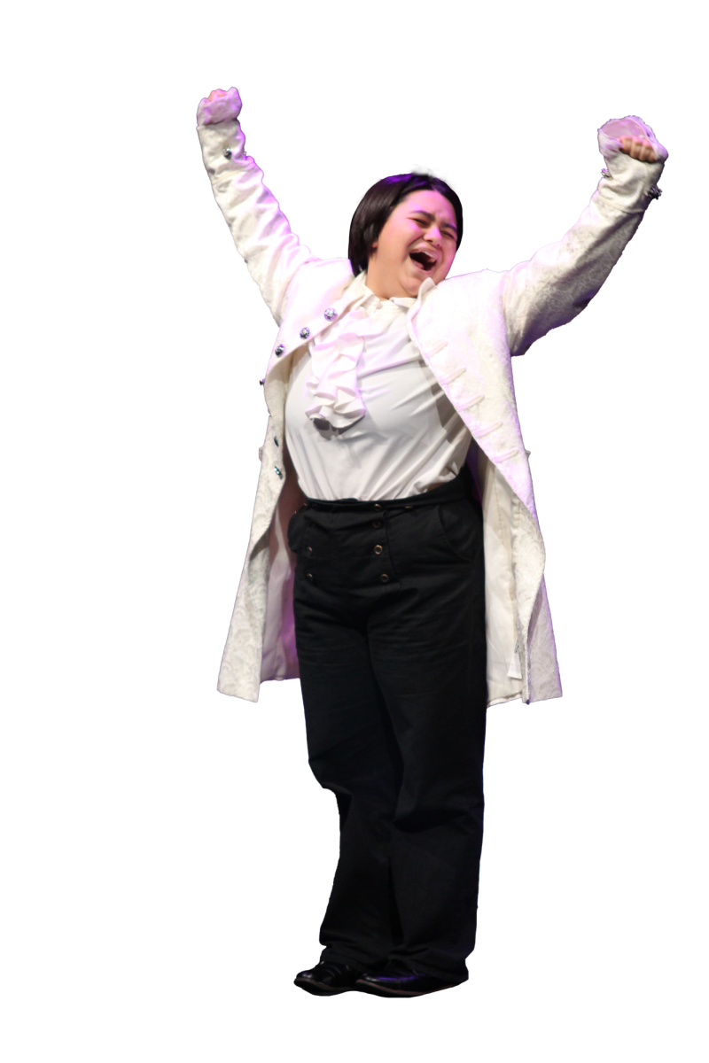 STAGED SLEEPING: Senior Damien Boring pretends to stretch and yawn as he performs in “The History of Tom Jones.” Boring played  Squire Allworthy and Henry Fielding and was able to showcase his comedy.