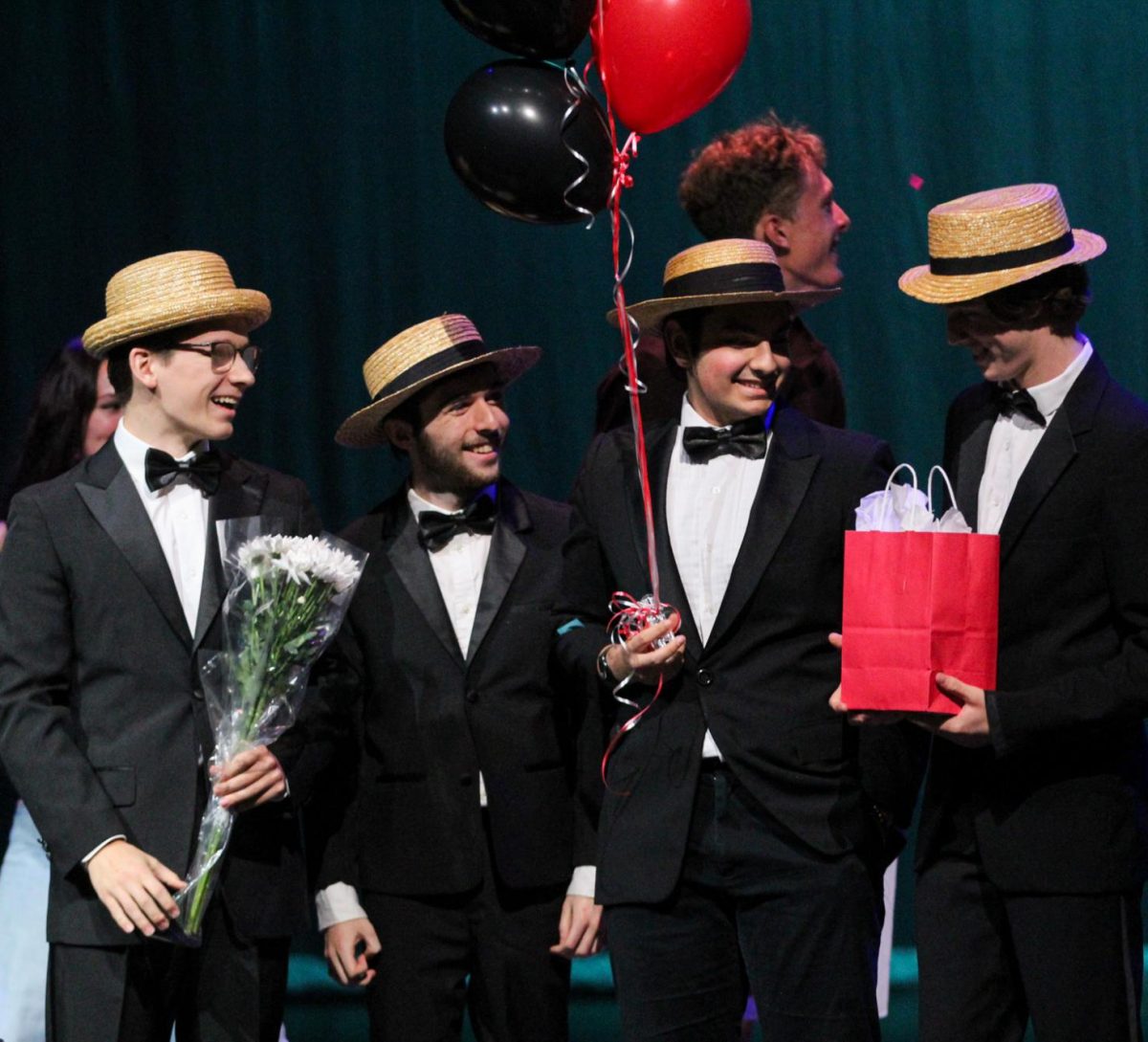 VICTORIOUS VOCALS: Seniors Gavin Sewell, Dylan Shahid-Russel, Aidan Schexnaydre, and junior Spencer Findley accept their Bowie’s Got Talent first place award. The four individuals were one of the finalists selected by the judges which the audience then got to vote on.