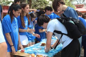 BLUE RETURNS: PALS students hand out cookies to students wearing blue during the Blue Out Bowie event. After not being held for several years, the tradition returned this year to raise awareness for Child Abuse Awareness Month. 
