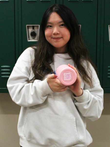 SAFETY GOES EVERYWHERE: LuluTag founder Karissa Lu holds up her QR coded water bottle while explaining how the technology helps students reconnect with lost belongings. Lu founded LuluTag in August after noticing overcrowded school lost and founds and realizing many students struggled to recover their items, inspiring her to create a low-cost, privacy-focused alternative to expensive GPS trackers.